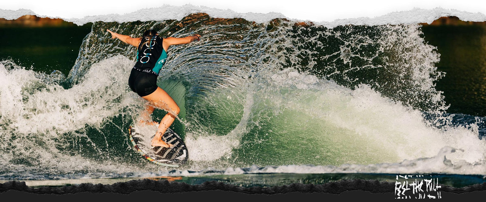 Woman riding a curl on the Liquid Force Ace Wakesurfer in a teal vest.