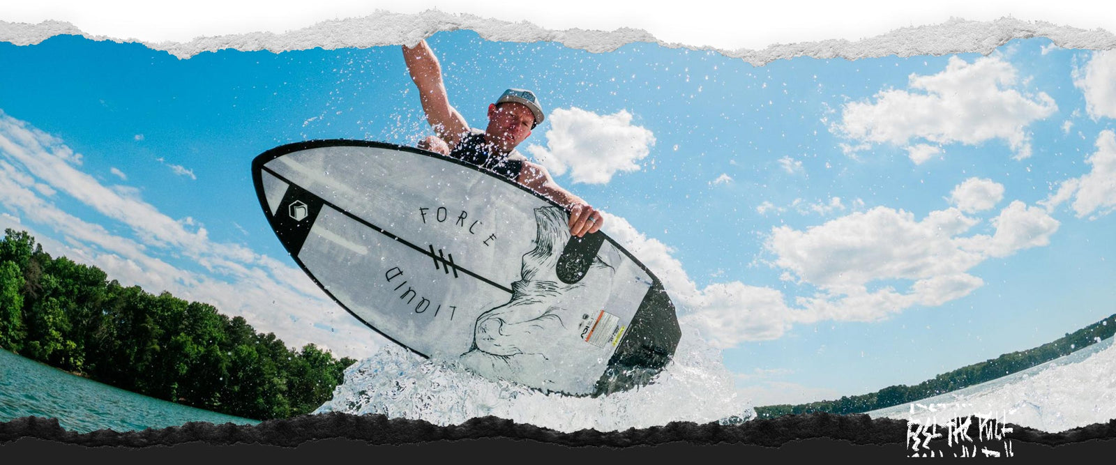 Man catching air on the Liquid Force Primo Wakesurfer under a blue sky.