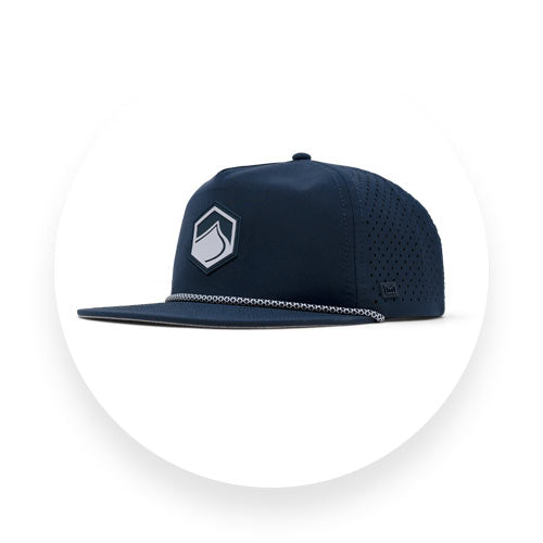 Angled view of navy Liquid Force snapback hat with perforated sides and front logo patch.