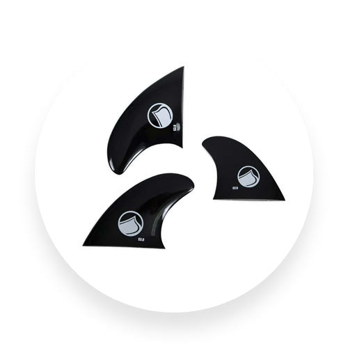 Three black Liquid Force surf fins with white logos displayed on white background.
