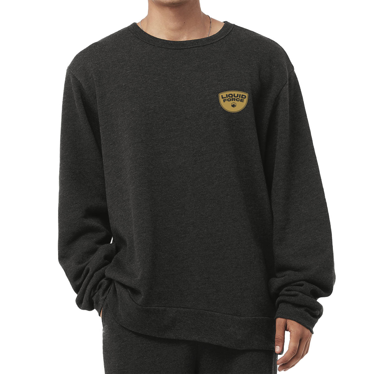 Person in a Lounge Crew, dark gray, yellow Liquid Force patch hoodie.