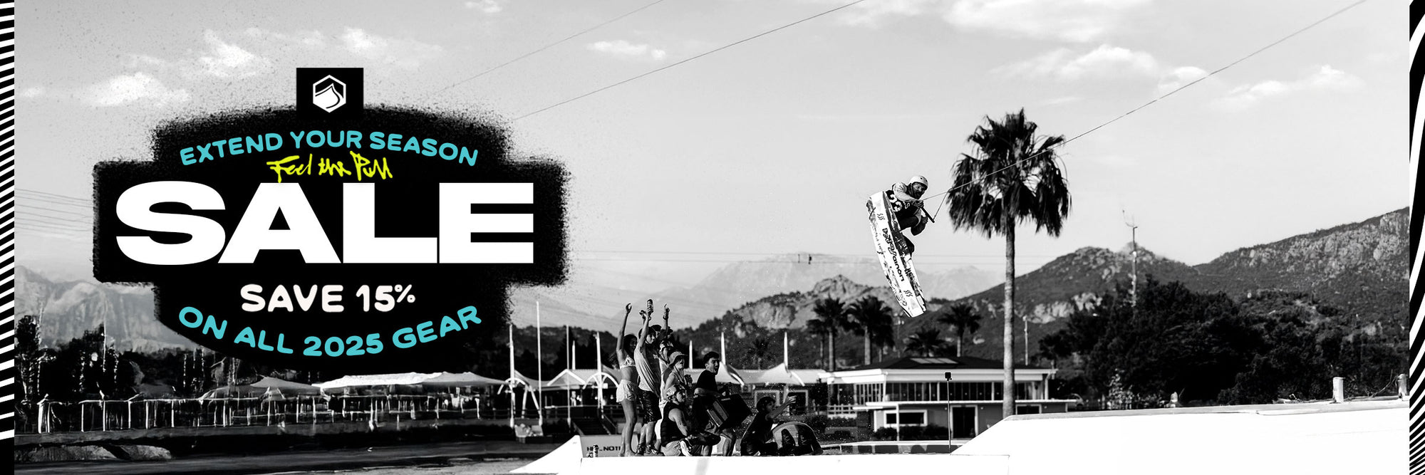 Black and White image of rider gapping a rail at a cable park. Sale promo on left hand side for 15% off 2025 gear.
