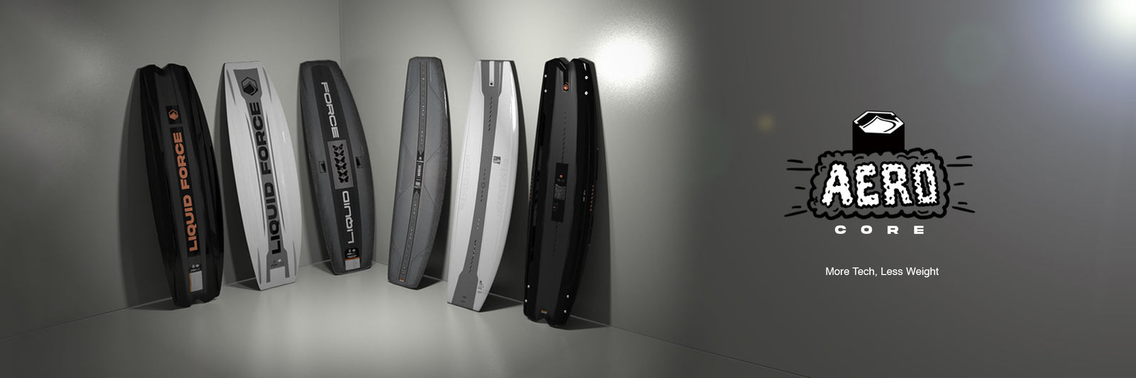 Six Liquid Force Aero wakeboards leaning against a wall with Aero Core logo at right.