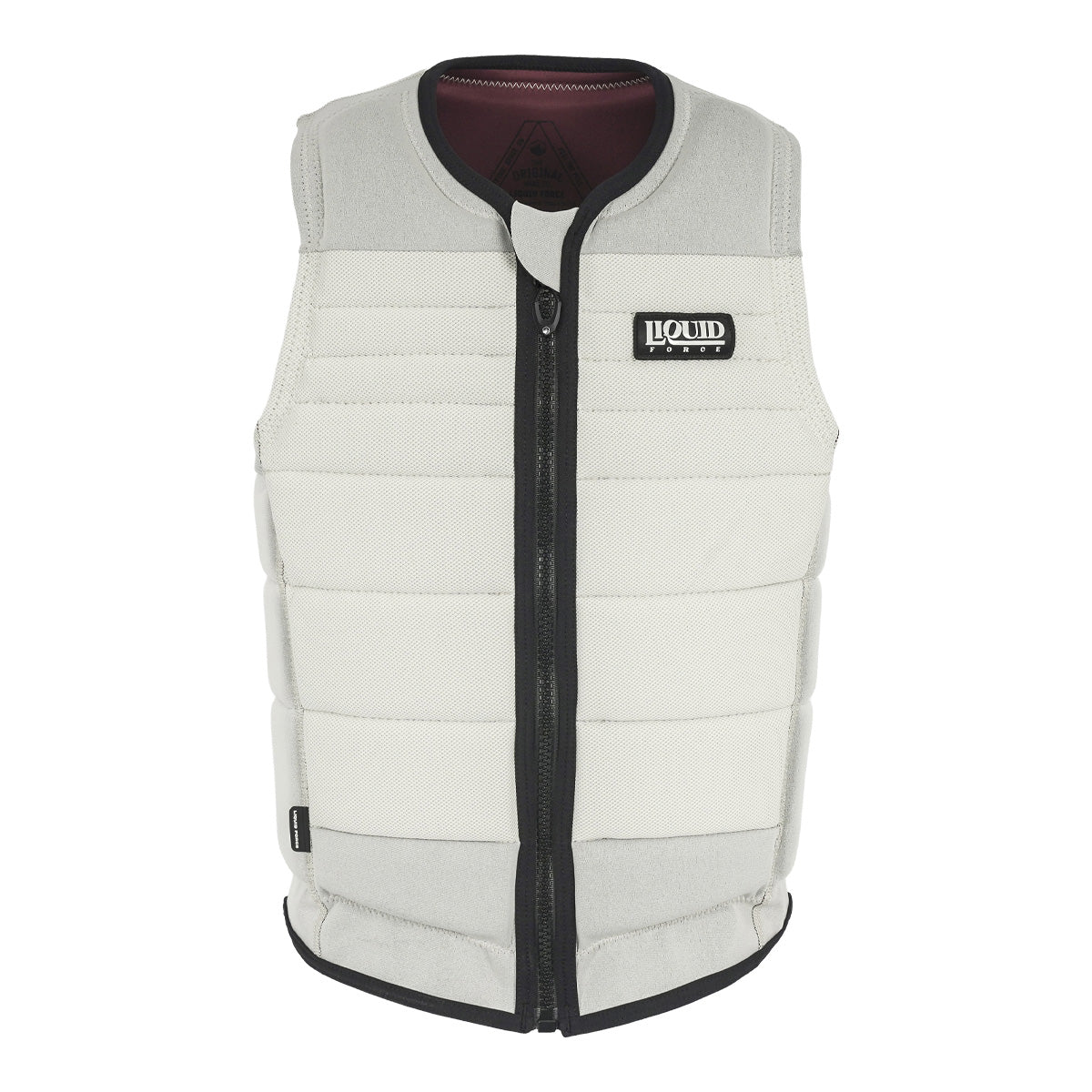 Front view of the Fuse Comp Vest in cream with black zipper and black logo patch on left chest.