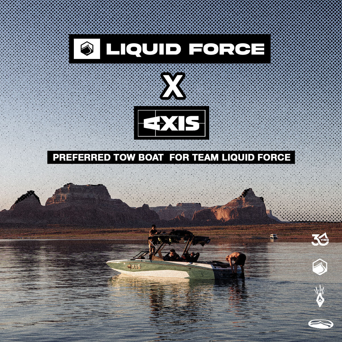 Green and white AXIS boat floating on the lake with red rocks in the background and a logo stating " Preferred tow boat for team LiquidForce