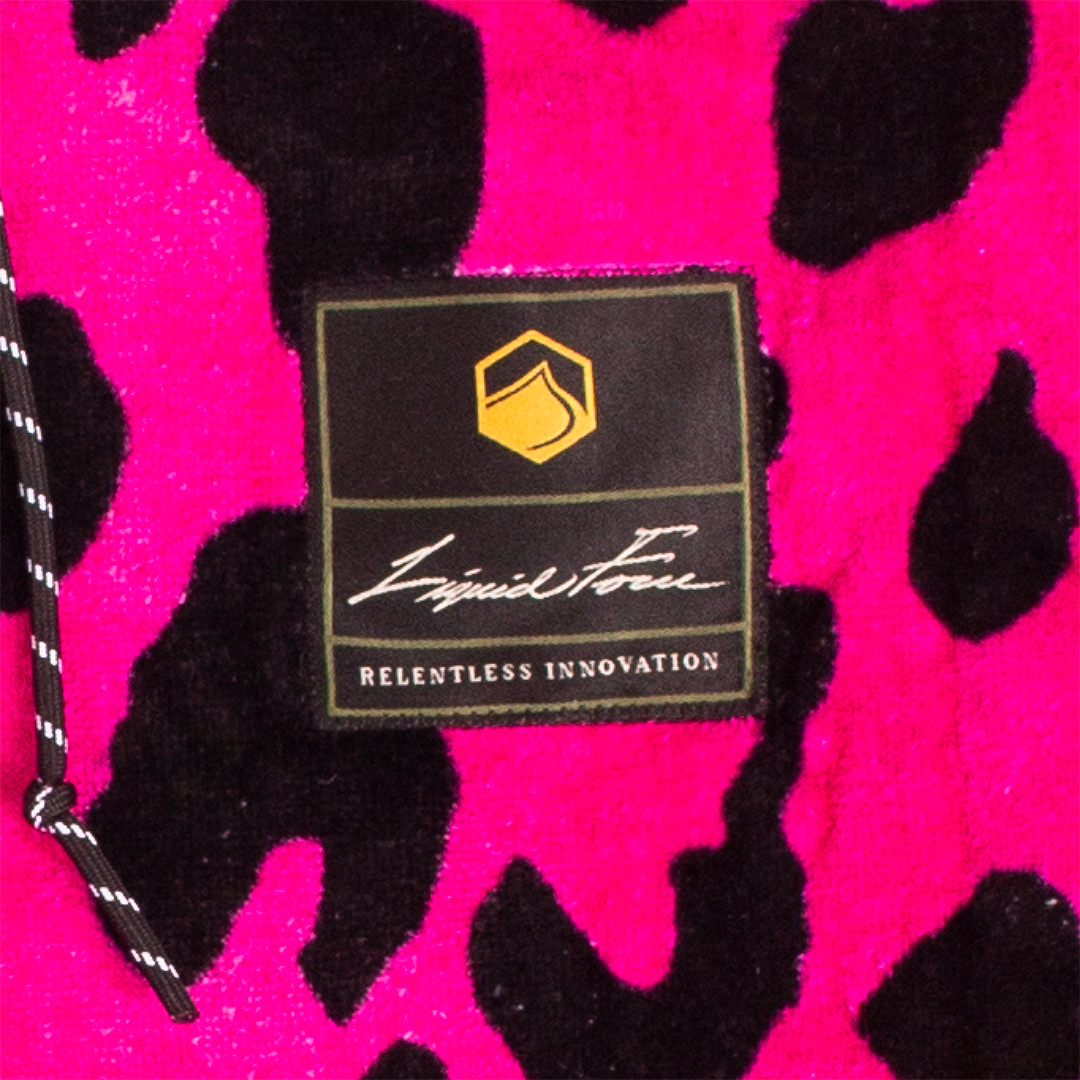 Label on pink &amp; black leopard print reads Punk Changer Towel.