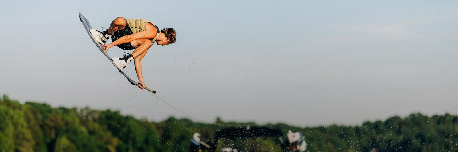 Liquid Force Boat Wakeboard Collection - LF Athlete Sam Brown grabbing his board in the air