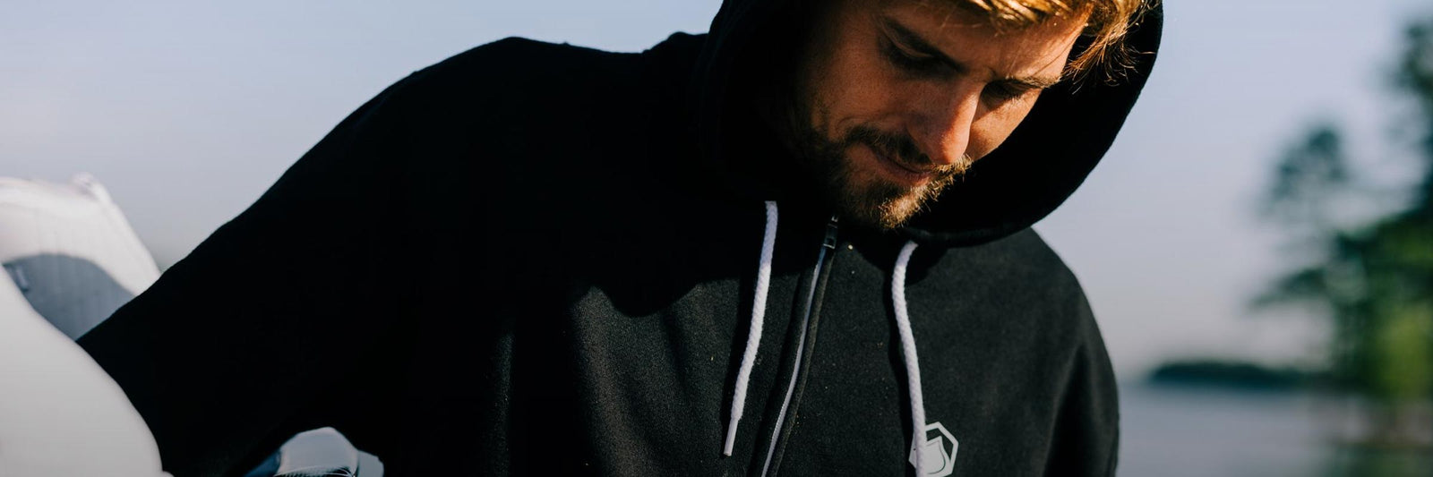 Liquid Force Sweatshirt Collection - Close up picture of LF Athlete Harley Clifford wearing a black LF Front-zip Hoody