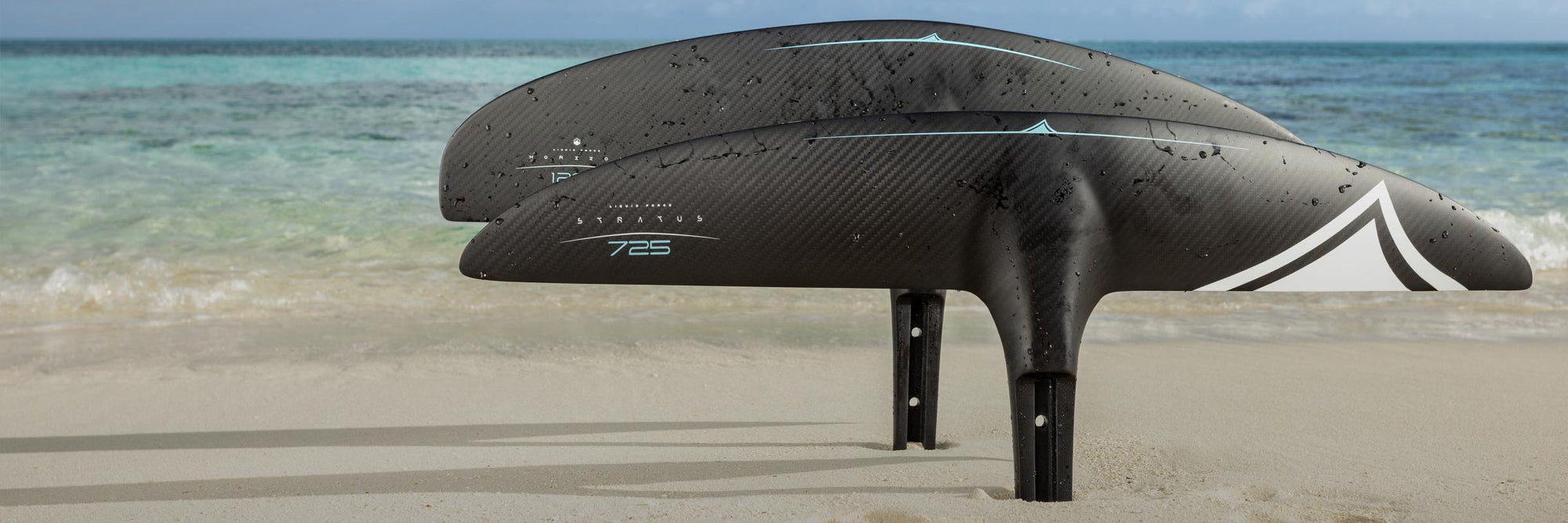 Liquid Force Foil Component Collection - Closeup shot of two LF FuseLock Front Wings posed on the beach