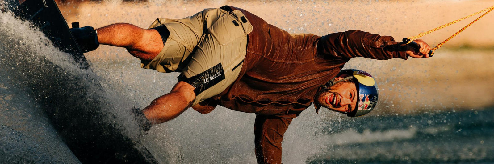 Liquid Force Merch Collection - LF Athlete Felix Georgii having fun riding his park wakeboard at a cable park.