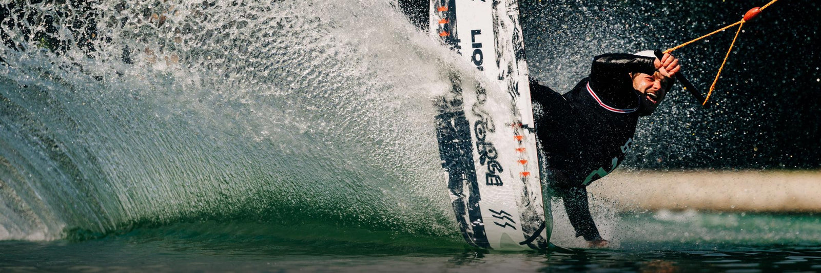 Liquid Force Park Wakeboard Collection - LF Athlete Matty Muncey carving around a turn at a cable park
