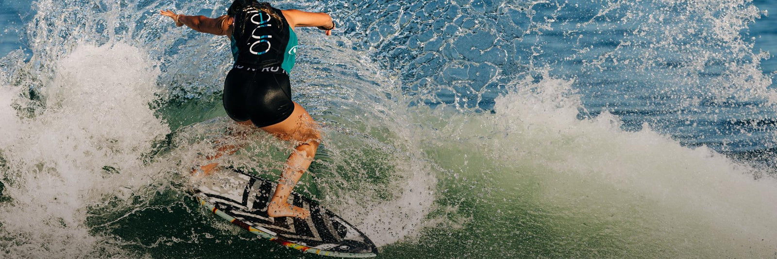 Liquid Force Skim Style Wakesurf Collection - Closeup shot of LF Athlete Bailey Dunn carving hard on a wakesurf board