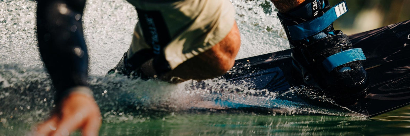 Liquid Force Wakeboard Package - Closeup shot of LF Athlete Felix Georgii carving his wakeboard on the water.