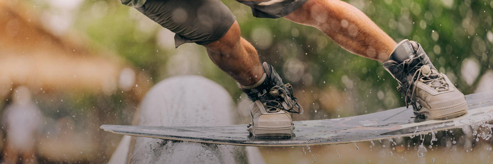 Close-up of a rider sliding a rail wearing 4D bindings.
