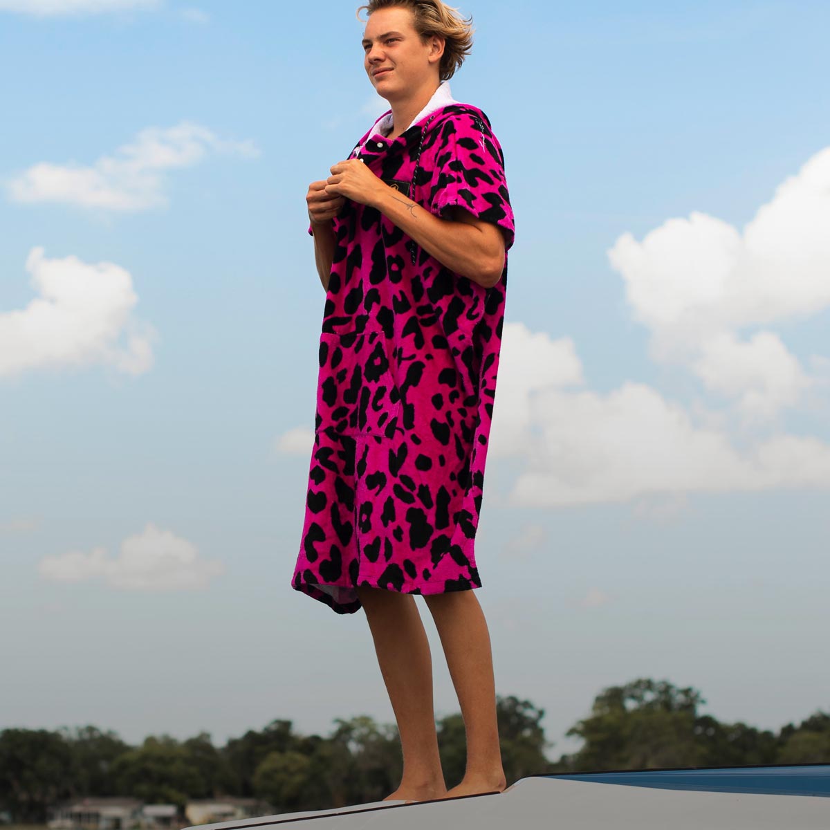 Liquid Force Changers & Towels Collection - Close up picture of LF Athlete Sam Brown in a LF Changer Towel with the sky behind him