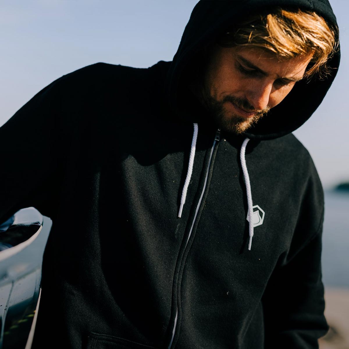 Liquid Force Sweatshirt Collection - Close up picture of LF Athlete Harley Clifford wearing a black LF Front-zip Hoody
