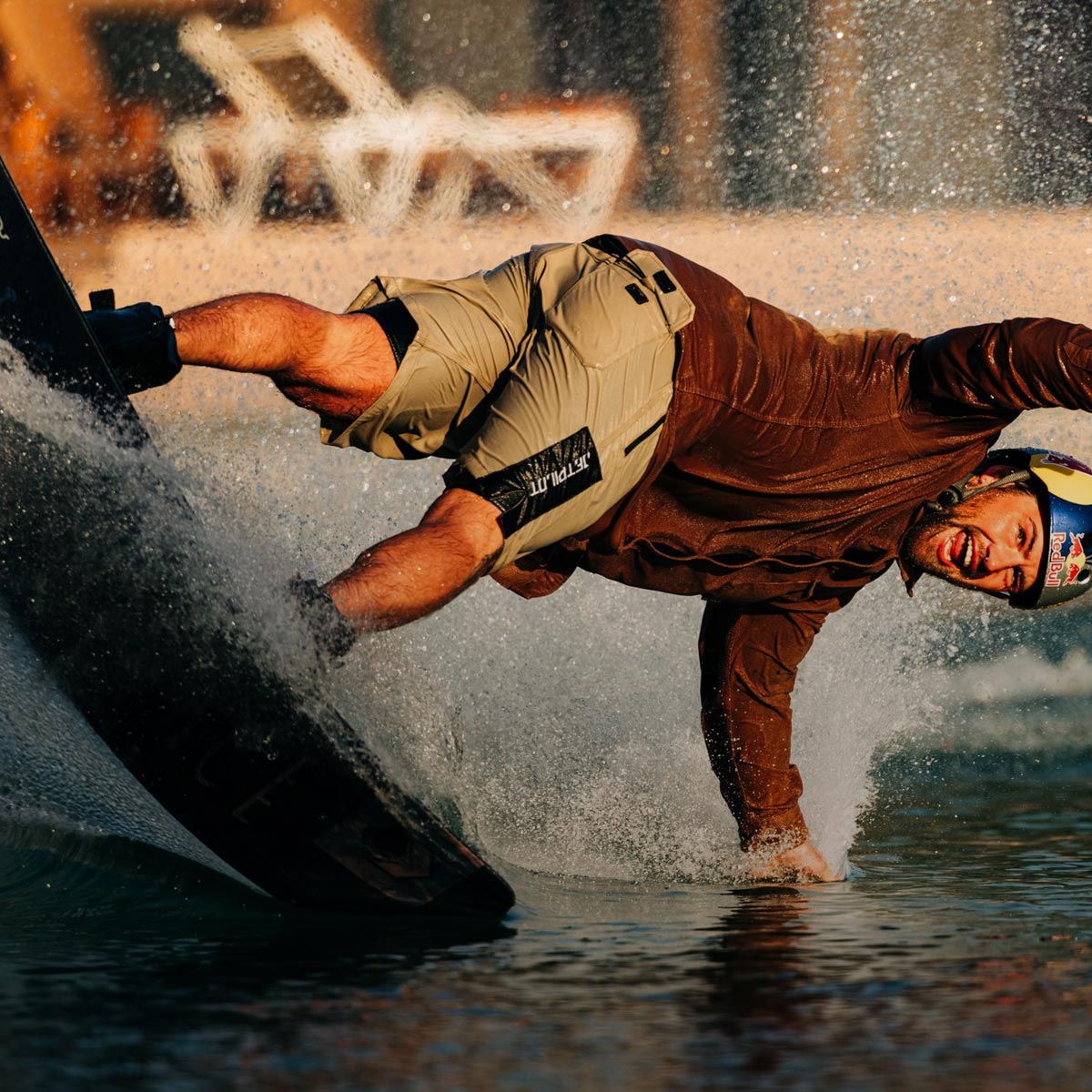 Liquid Force Merch Collection - LF Athlete Felix Georgii having fun riding his park wakeboard at a cable park.