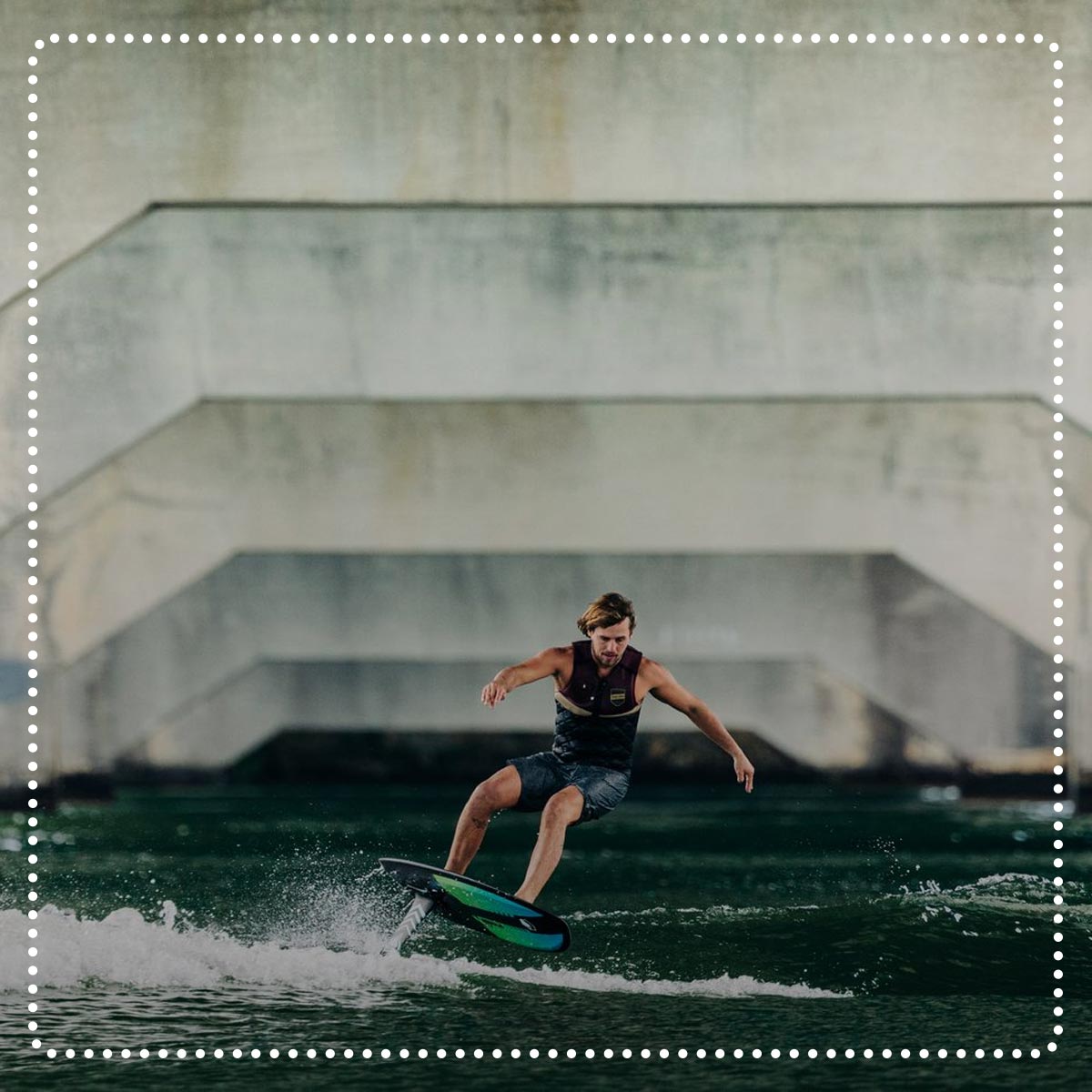 Liquid Force Clearance Foil Collection - LF Athlete Harley Clifford foiling under an overpass.