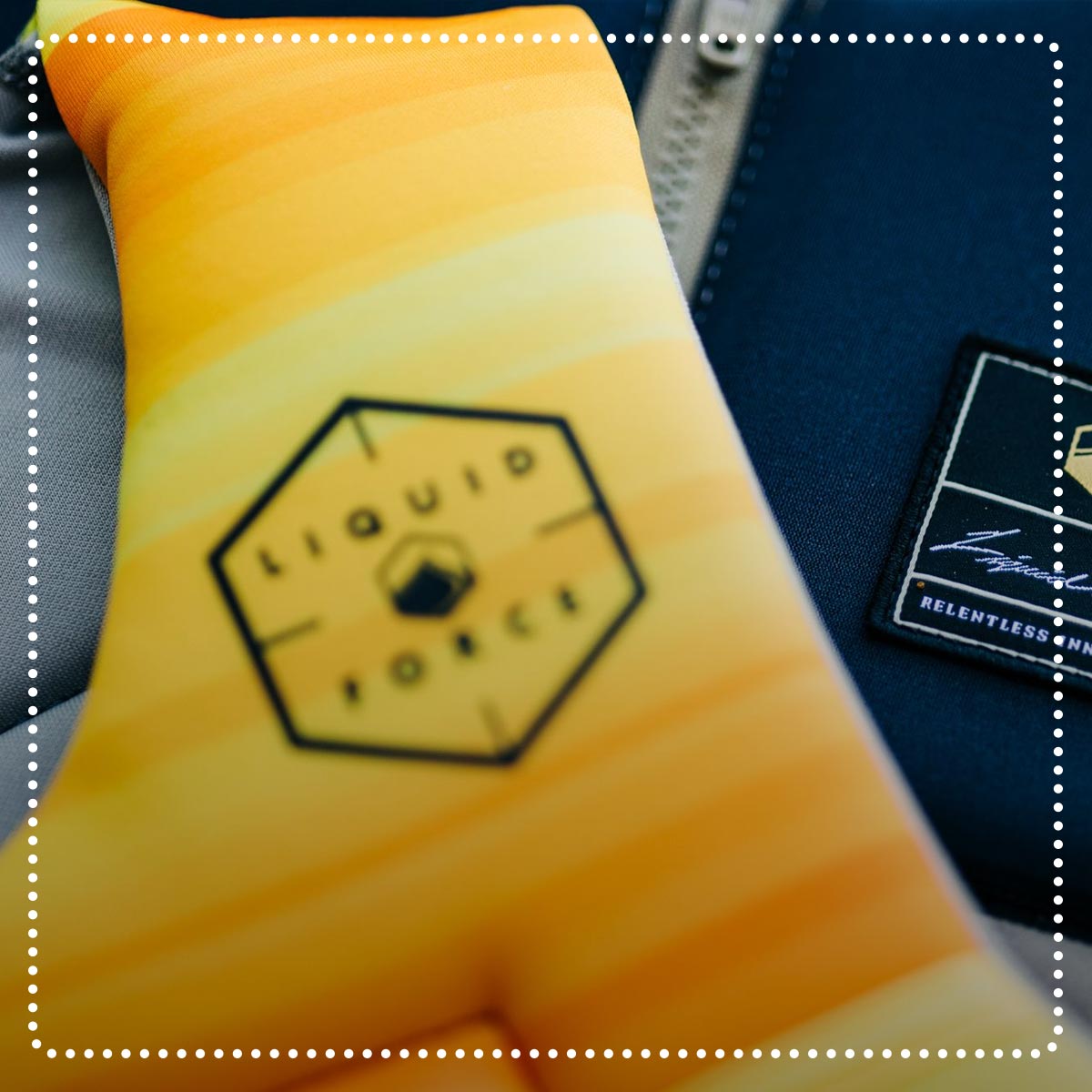 Liquid Force Clearance Vests Collection - Closeup shot of two vests and the LF Logos on them.