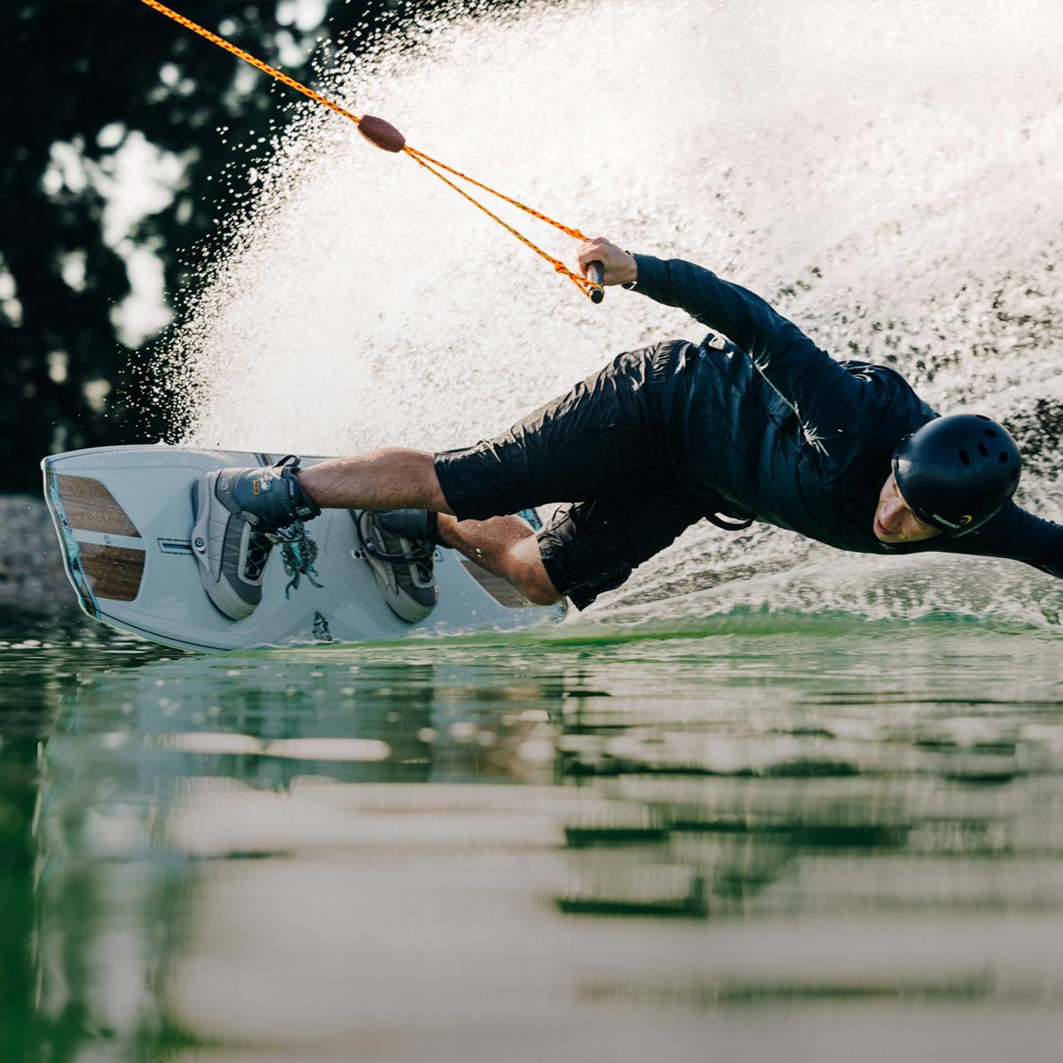 Liquid Force Park Wakeboard Package Collection - Closeup shot of LF Athlete Nico Von Lerchenfeld carving hard around a corner at a cable park