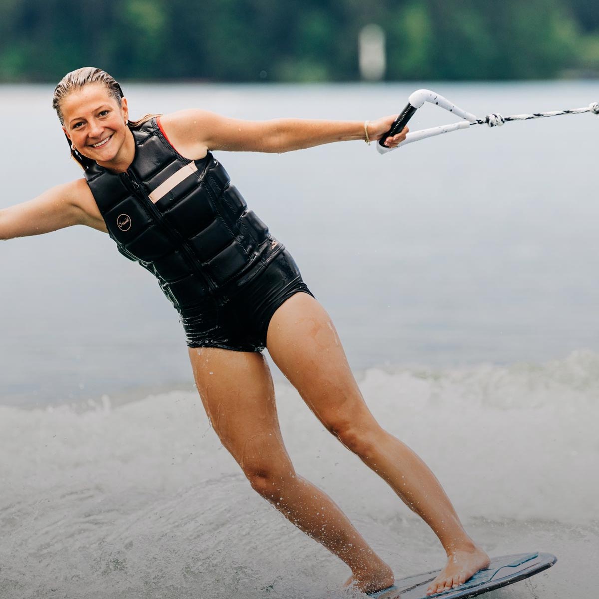 Liquid Force Ropes & Handle Collection - Close up picture of LF Athlete Bailey Dunn holding on to a LF Rope/Handle Combo while wakesurfing