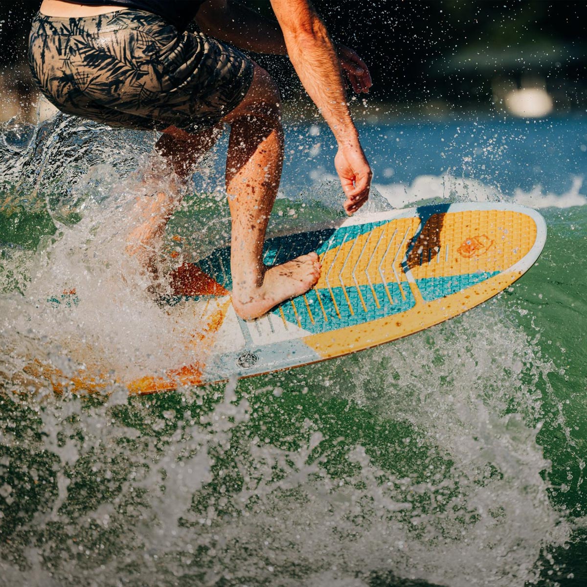 Liquid Force Surf Style Wakesurf Collection - Closeup shot of LF Athlete riding a wakesurf board