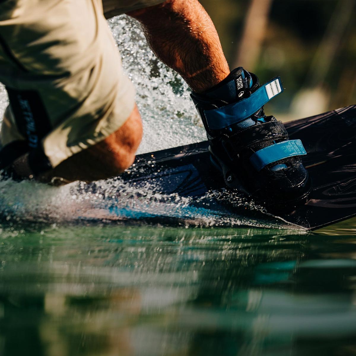 Liquid Force Wakeboard Package - Closeup shot of LF Athlete Felix Georgii carving his wakeboard on the water.