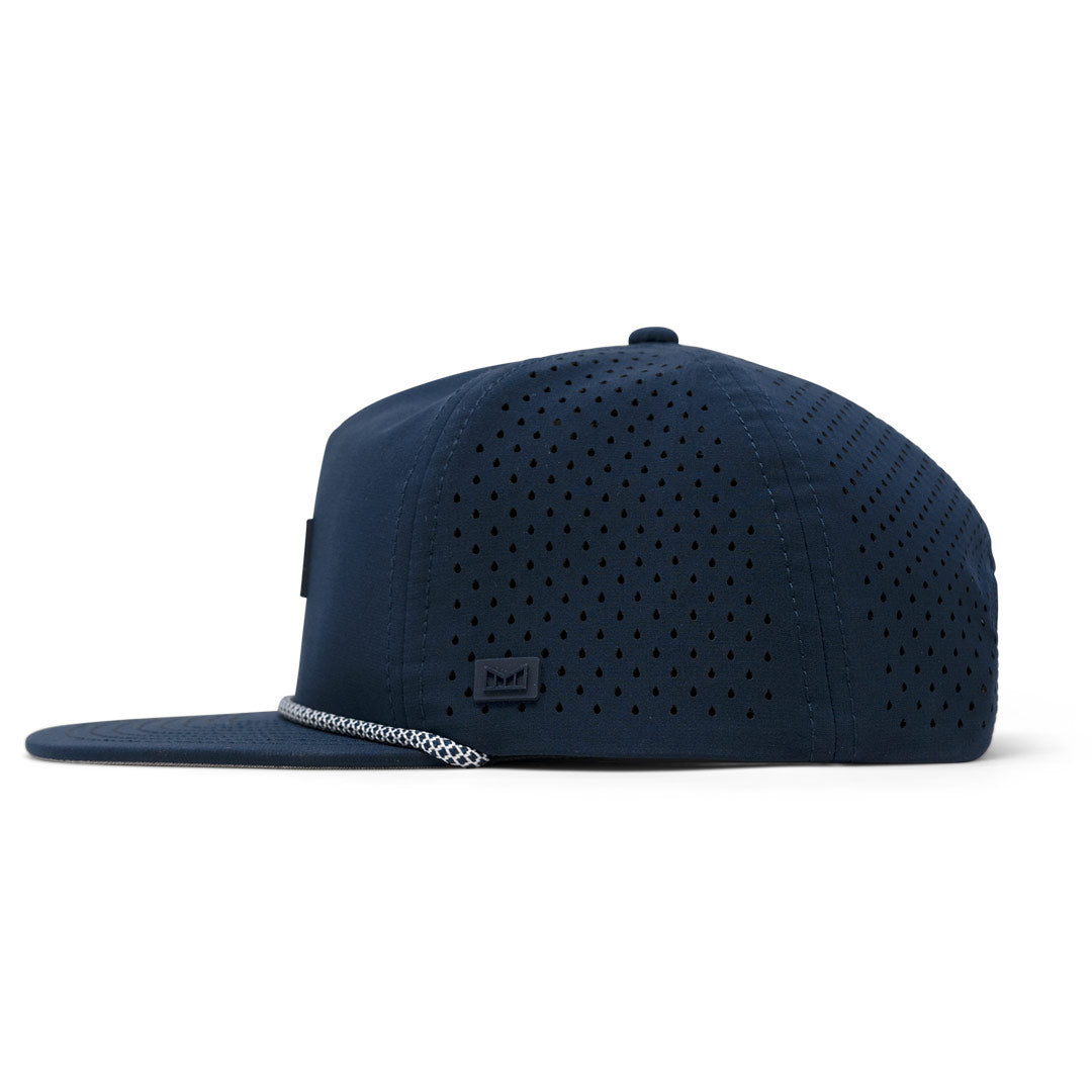 Navy perforated LF x melin Coronado Hydro flat brim hat with small side label.
