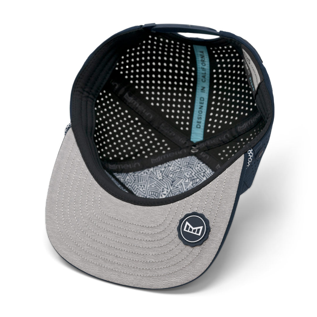 Inside view of the LF x melin Coronado Hydro Snapback Hat with a logo on the patterned brim.