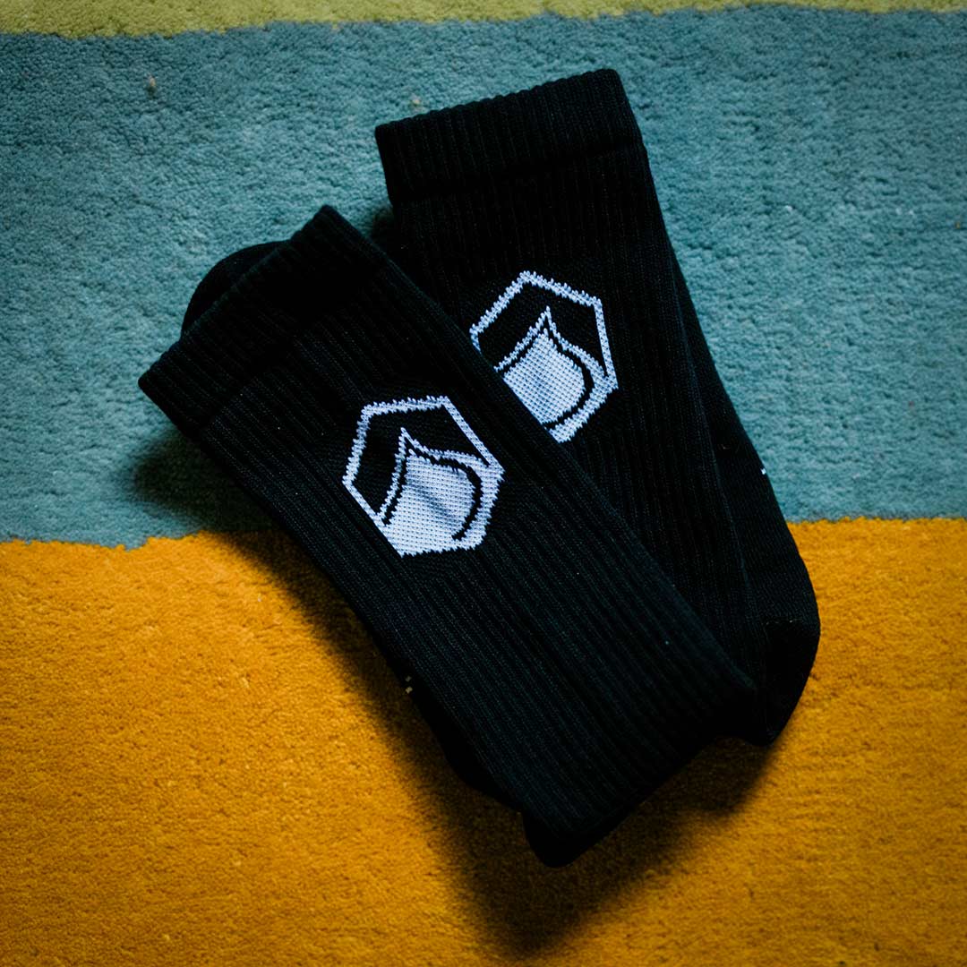 Two pairs of LF x Stinky Crew Socks with branded tags viewed from above the product looking down.