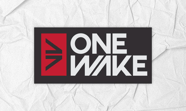 One Wake logo in white and red on a white paper textured background.