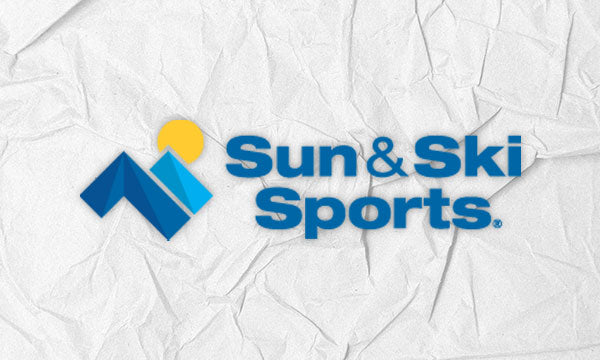 Logo for Sun & Ski Sports with a textured white finish.
