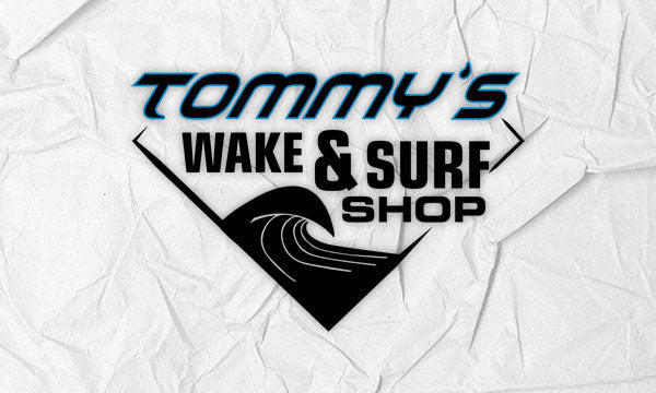 Tommy's Wake and Surf Shop logo on a white background.