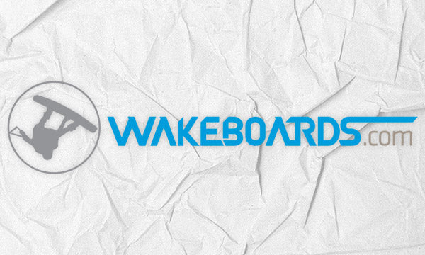 Wakeboards.com logo on a white paper texture background.