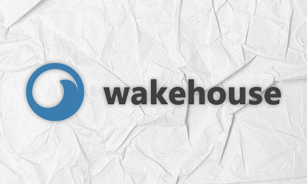 Logo featuring a blue wave icon and the word wakehouse on crumpled paper.