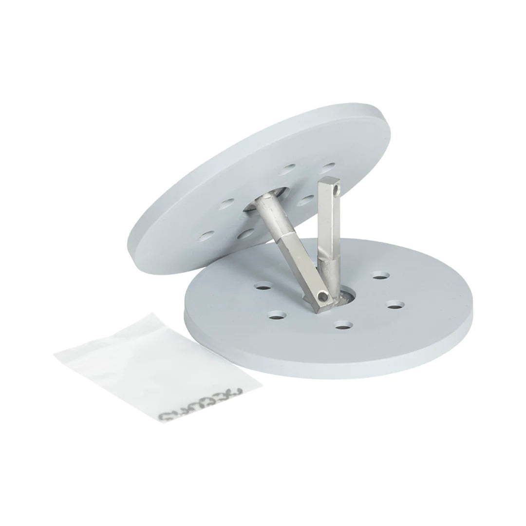 Large wakesurf edge replacement suction cups beside a gray rubber base and metal prong for mounting.