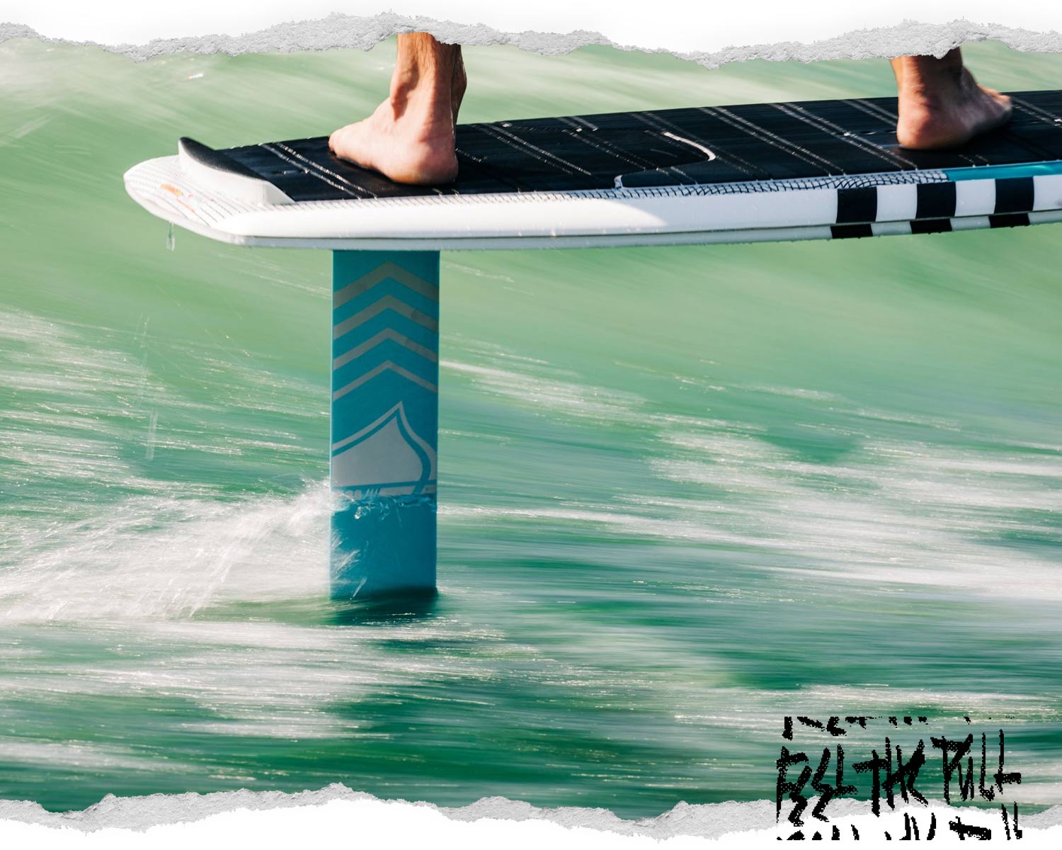 Liquid Force 28" alloy foil mast cutting through bright green water.
