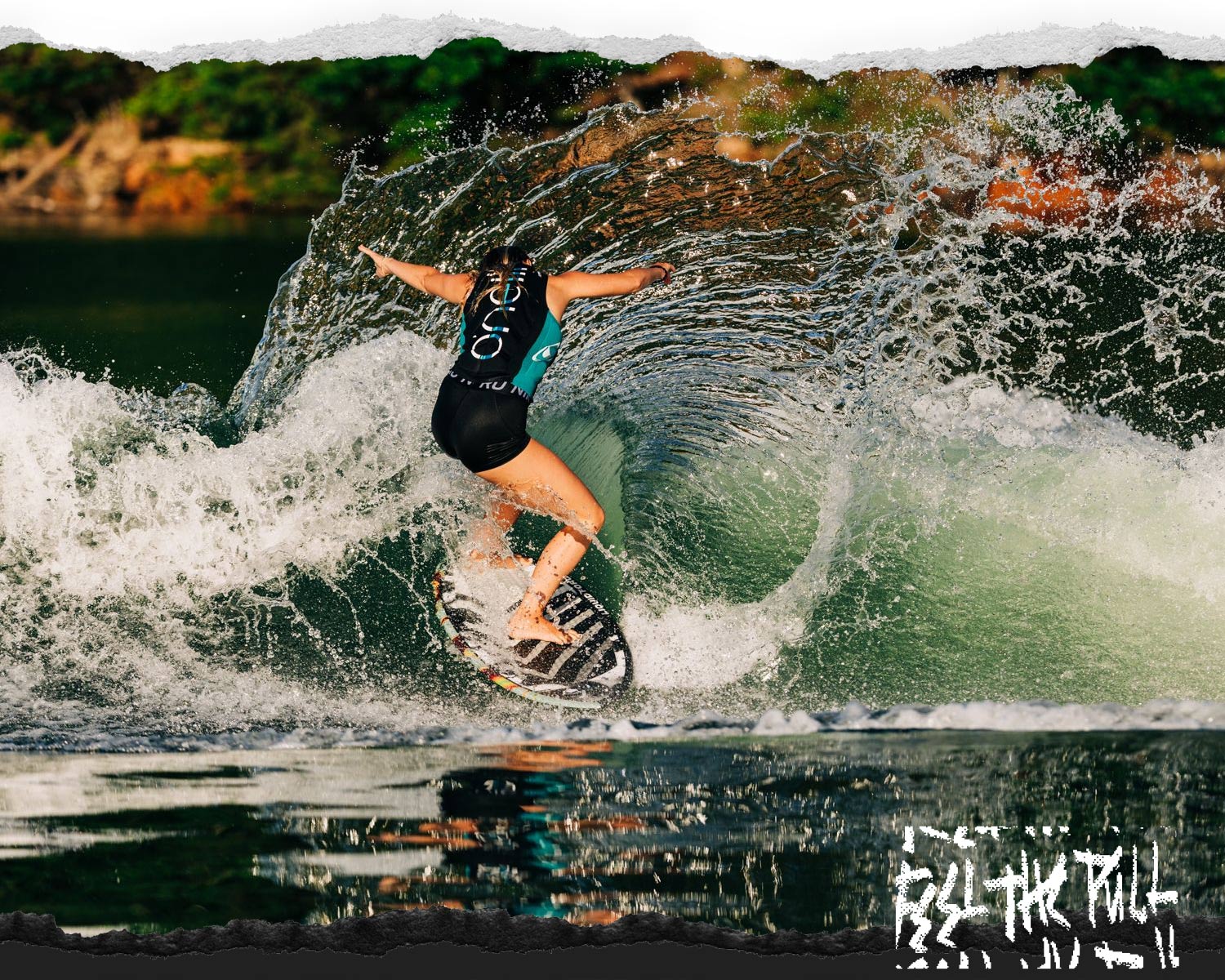 Woman riding a curl on the Liquid Force Ace Wakesurfer in a teal vest.