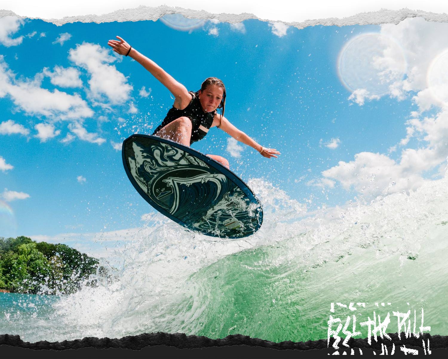 Woman surfing a wave on the Liquid Force Blade Wakesurfer in a black vest.