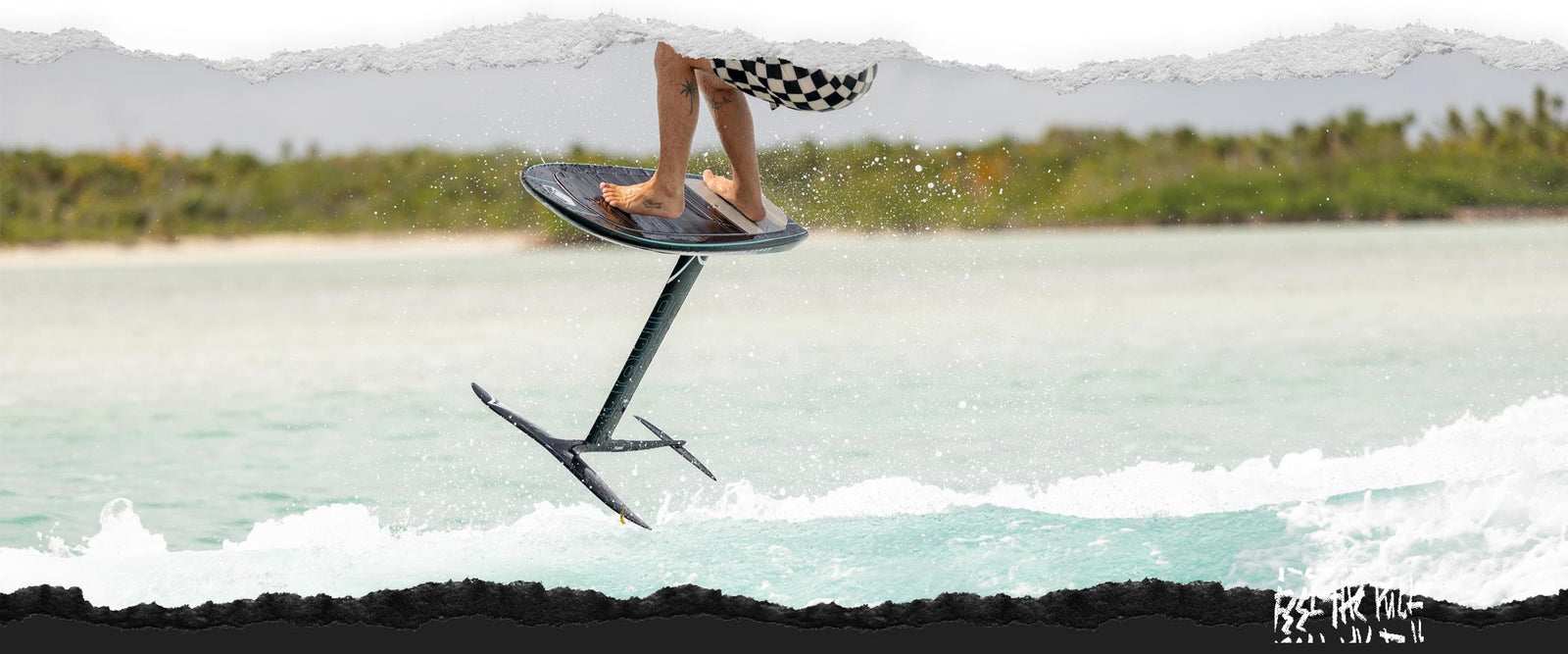 Close-up of foil board in mid-air above turquoise water, rider cropped out.