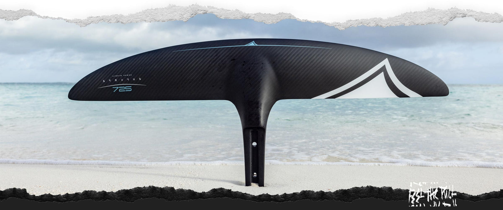 Black Stratus 725 foil wing displayed vertically on a sandy beach.