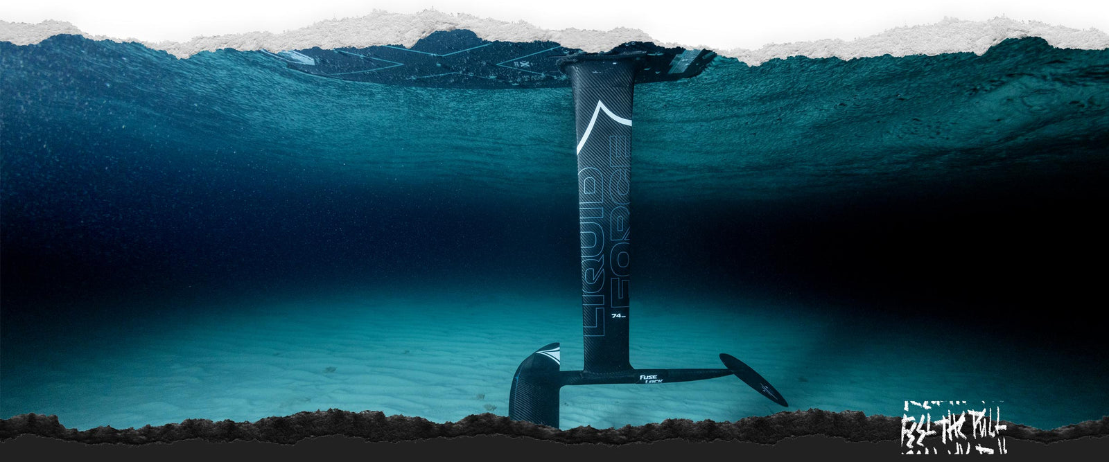 Underwater view of Liquid Force Carbon Stratus foilset gliding beneath the surface.