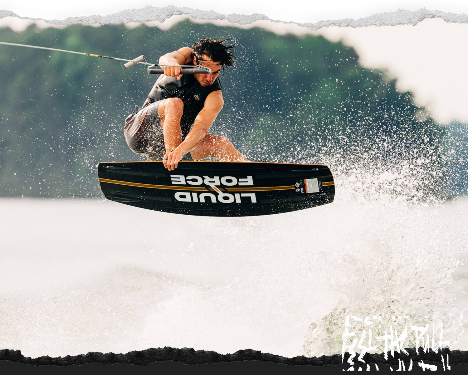 Rider launches off wake on black and yellow Liquid Force board.