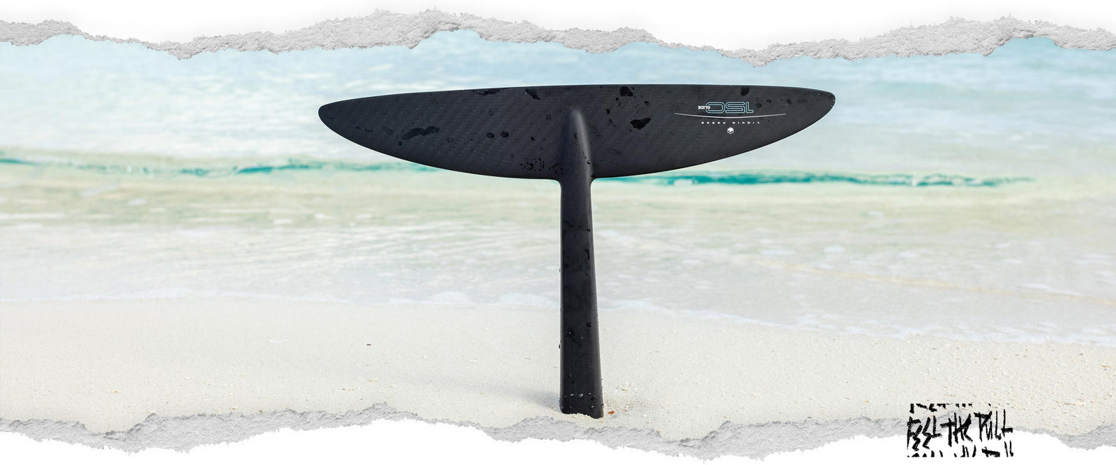 Glide Surf 150 foil front wing with vertical mast on wet sand near shoreline.