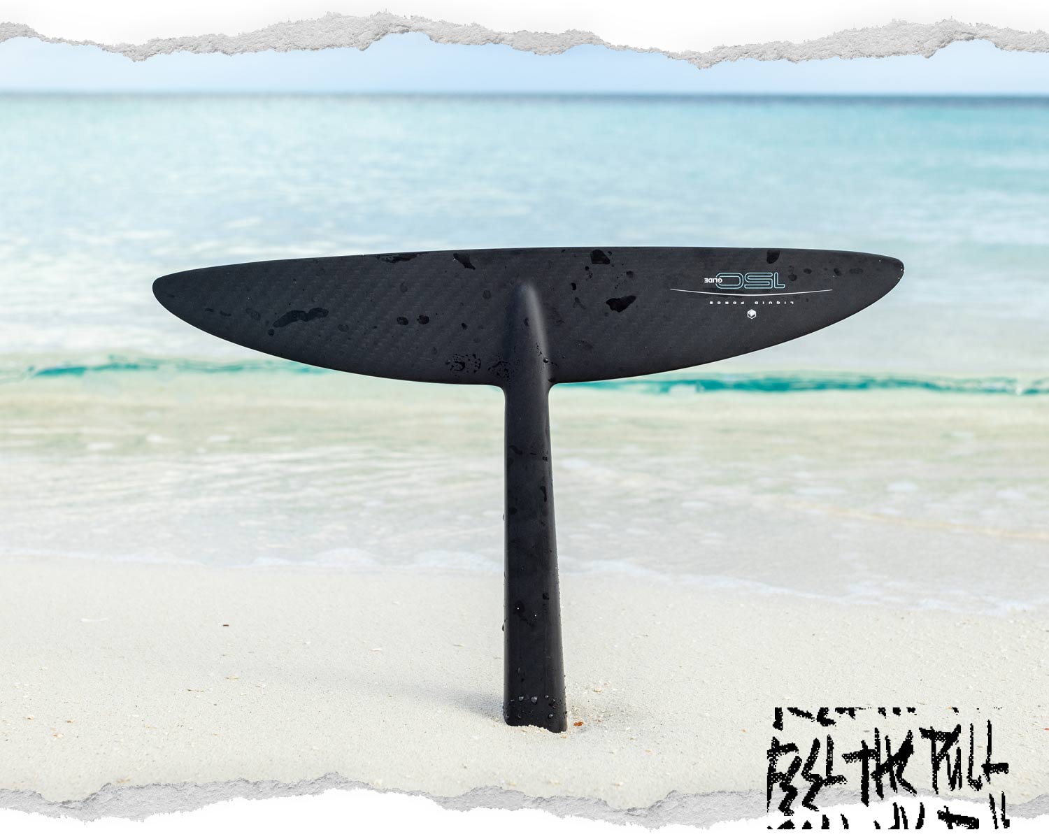 Glide Surf 150 foil front wing with vertical mast on wet sand near shoreline.