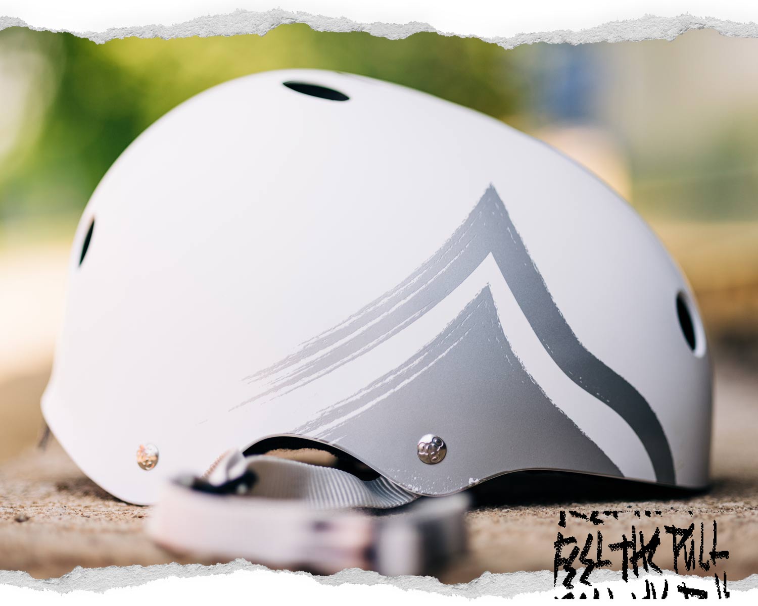 Close-up of Liquid Force Hero Helmet with white and gray wave graphics.