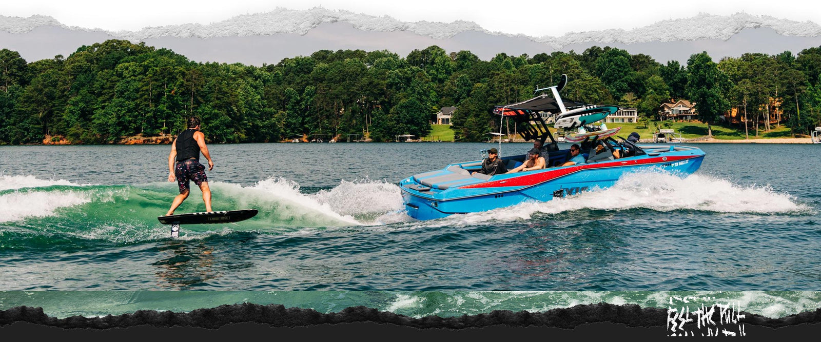 Rider surf foiling behind blue boat using Legacy Horizon Surf foilset on lake.