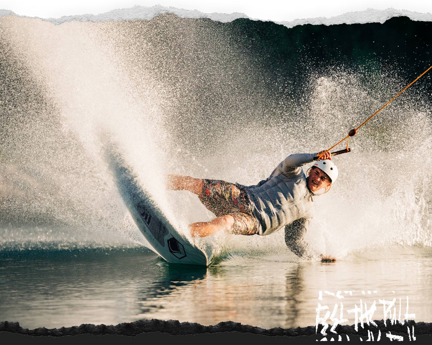 Rider doing aggressive carve on white Noodle wakeboard at golden hour.