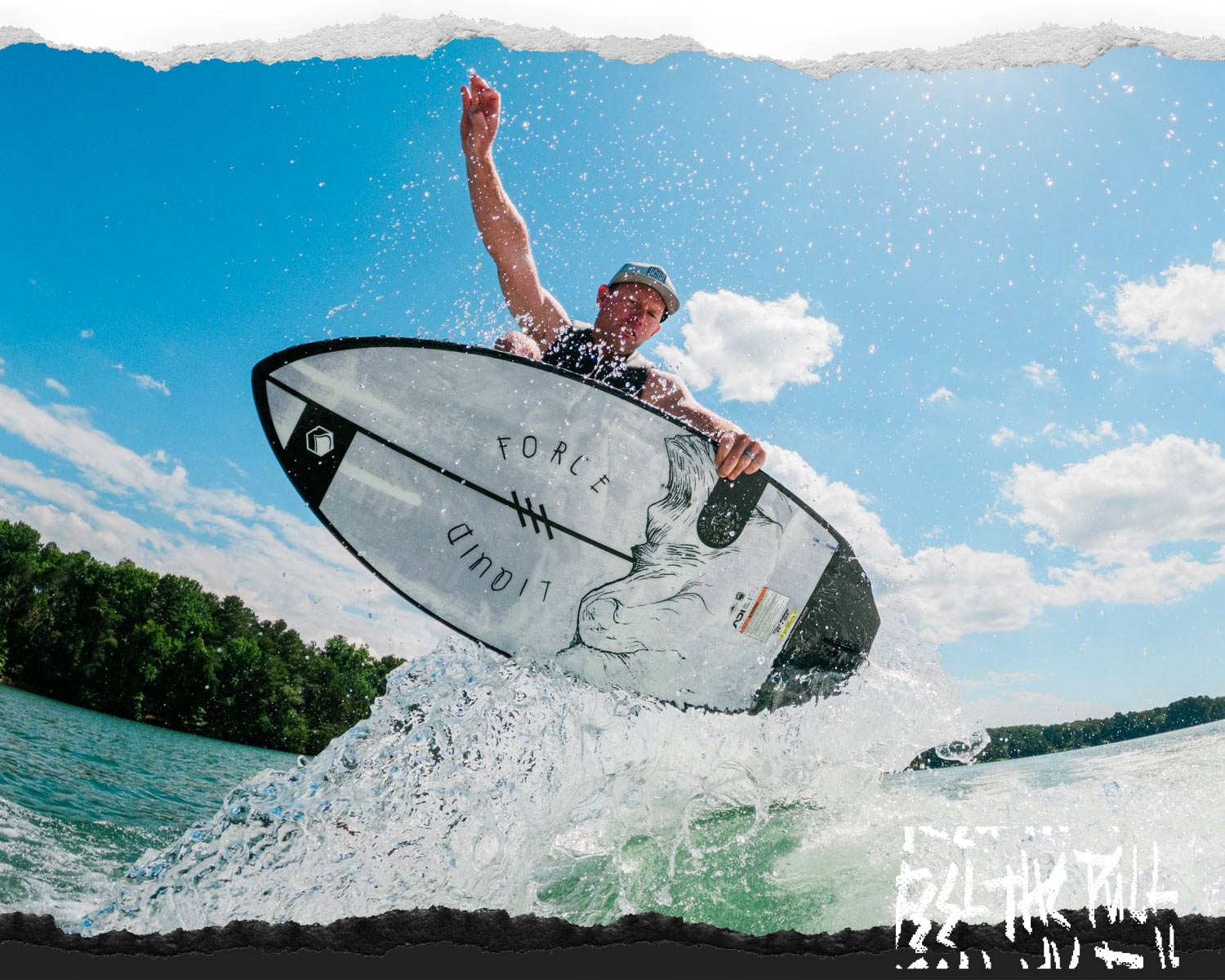 Man catching air on the Liquid Force Primo Wakesurfer under a blue sky.