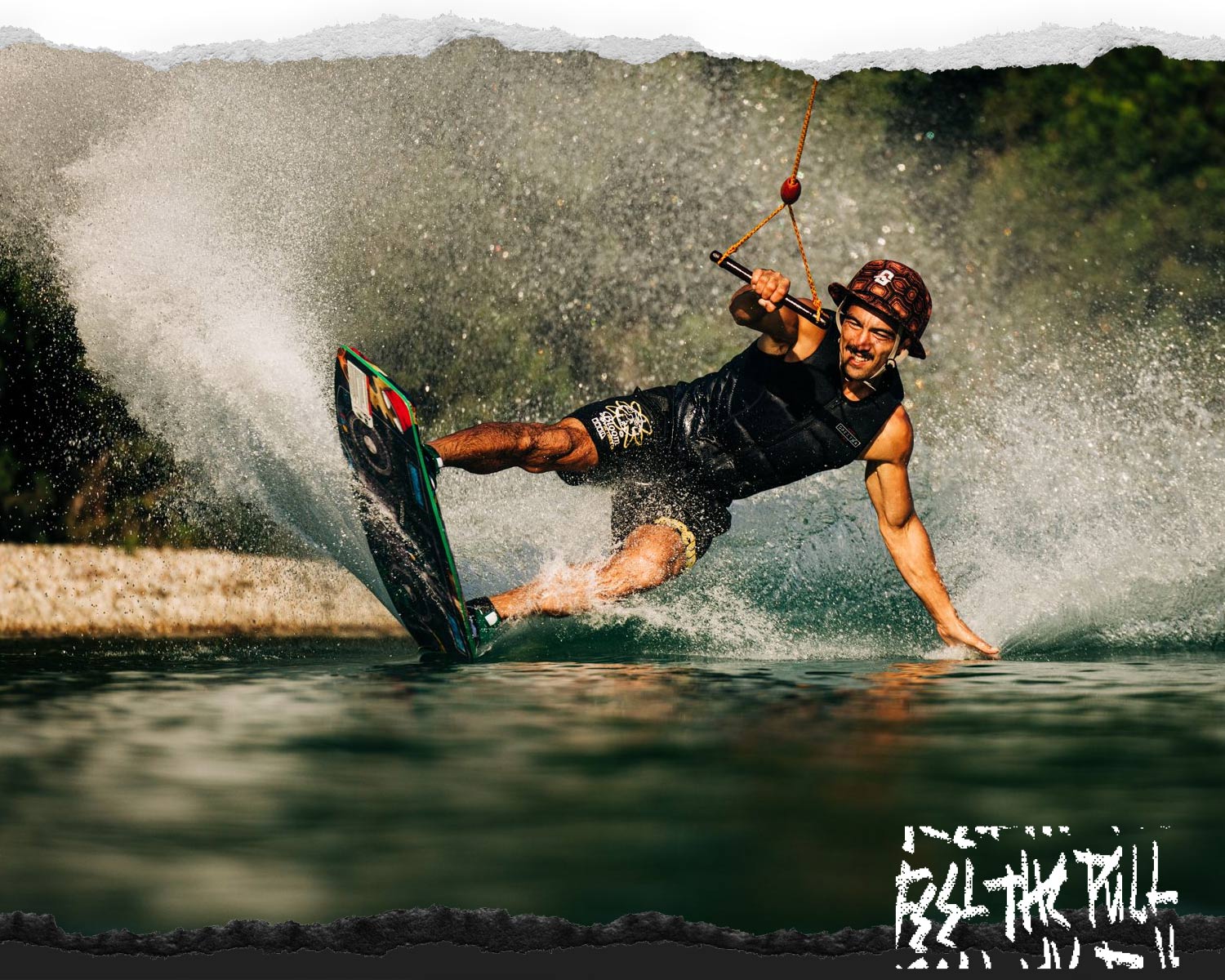 Rider in black vest carving hard on the Liquid Force Tao Wakeskate.